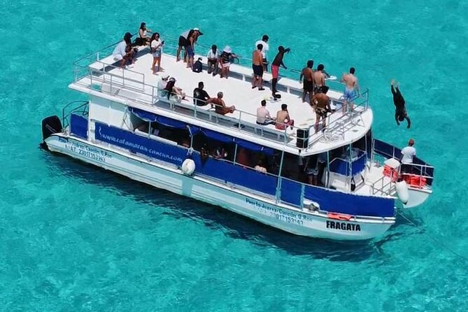 Catamaran in Cozumel with snorkeling at El Cielo and open Bar - Crew, Entertainers, and the Boat That Makes It Easy