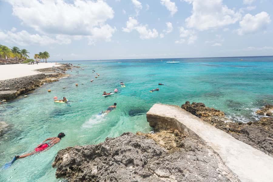 Cozumel: Chankanaab Park Admission+ Snorkel+ Welcome drink - The beach between swims: loungers, hammocks, and shaded palapas