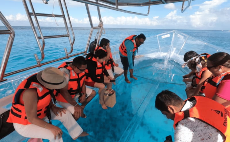 Explore the sea of cozumel in a transprent boat with drinks and snorkel. - The Lego artificial reef: snorkeling finale (optional)
